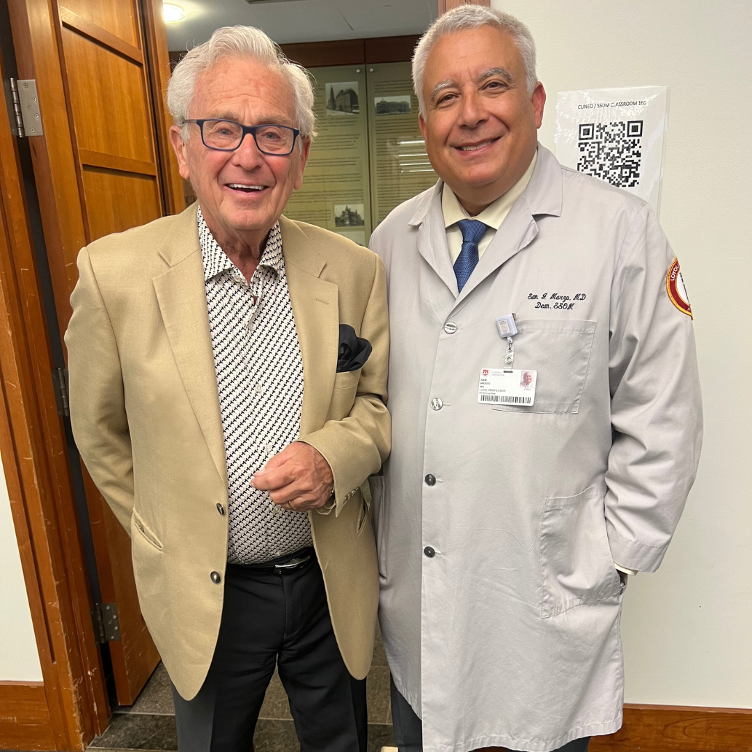 Alumnus Dennis Gates (M.D. '65) on the left with Stritch School of Medicine, Dean Marzo.